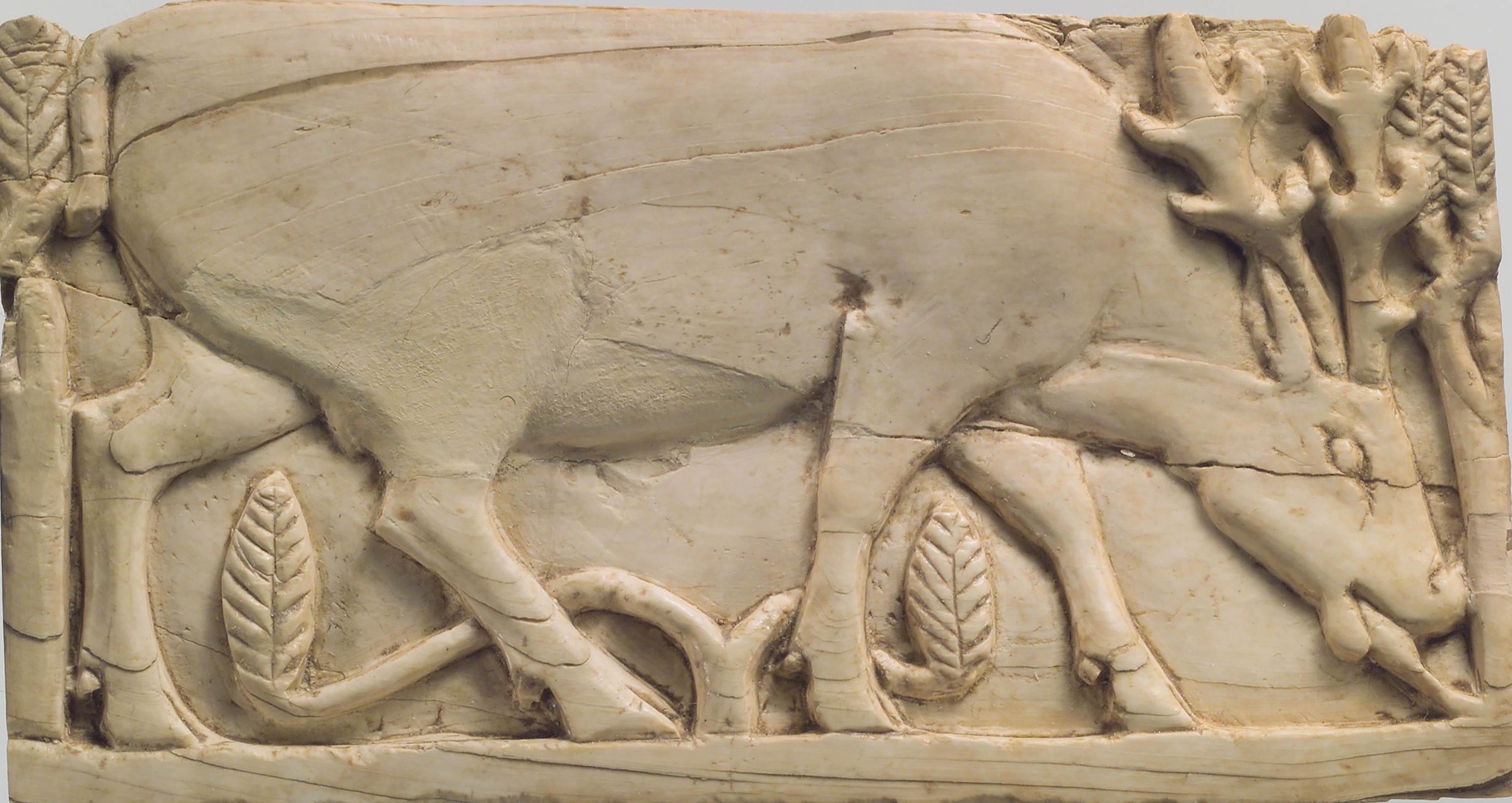 Arslan Tash: cow licking the tail of a suckling calf